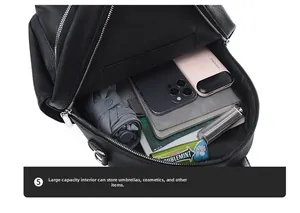 Top view of spacious interior compartments of the black PU leather backpack with daily items