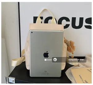Size comparison of cream nylon backpack with tablet showing large storage capacity