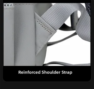 Detail of reinforced bar-tacking stitching on shoulder straps of the travel backpack