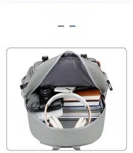 Detailed interior of the grey travel backpack showing large capacity for electronics and books