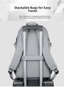 Light gray travel backpack with a luggage strap on the back for easy attachment to suitcase