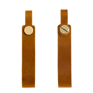 Detail of premium brown leather pull straps with elegant gold screw fasteners