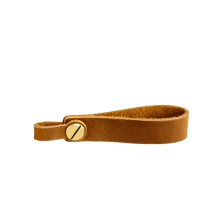Detail of vintage brown leather strap with gold screw fastener and rustic texture