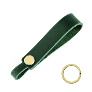 Detailed view of dark green crazy horse leather keychain with gold-plated rivet and ring