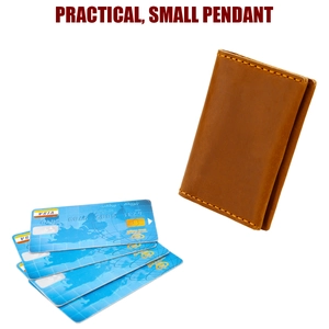 Detail view of vintage crazy horse leather card holder with hand-stitched seams and card slots