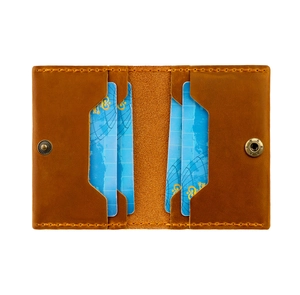 Brown crazy horse leather card holder with symmetric slots and antique bronze snaps