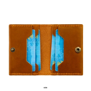 Detail view of crazy horse leather wallet with four card slots and metal snap button