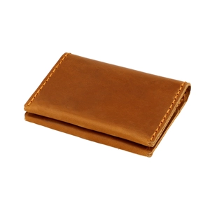 Brown crazy horse leather card holder with handmade stitching and minimalist bi-fold design