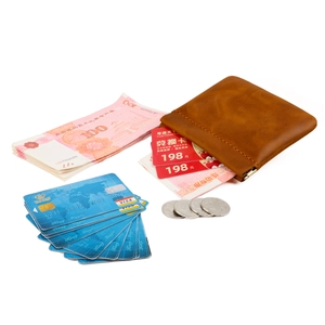 Brown crazy horse leather coin purse showing interior storage for cards and cash
