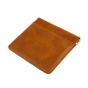 Detail of crazy horse leather coin pouch showing shrapnel closure and vintage stitching