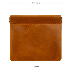 Macro detail of crazy horse leather coin purse with auto-close metal spring clip
