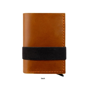 Back view of brown crazy horse leather wallet with black elastic strap and orange stitching