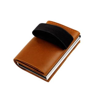 Macro detail of brown crazy horse leather wallet with RFID blocking silver aluminum pop-up card case