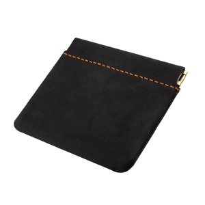 Detail of crazy horse leather coin purse with auto-close metal spring and orange stitching
