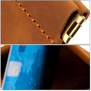 Macro shot of crazy horse leather stitching and metal snap closure on a brown wallet
