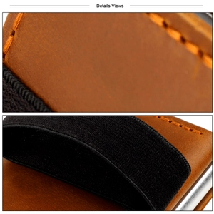 Close-up of crazy horse leather wallet with orange contrast stitching and elastic band