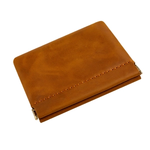 Brown crazy horse leather coin purse with metal spring closure and hand-stitched detail