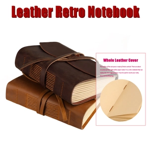 Macro view of vintage handmade cowhide notebook with leather strap closure and refillable pages