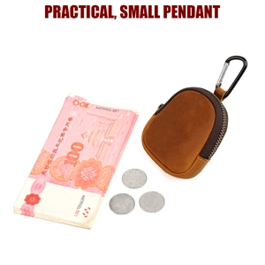 Detailed view of a brown crazy horse leather coin purse with a silver metal carabiner clip