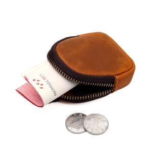 Macro shot showing internal capacity of brown crazy horse leather zipper coin purse