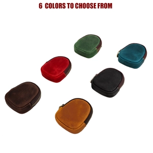 Close-up of small semi-circular crazy horse leather coin purses in six vibrant colors