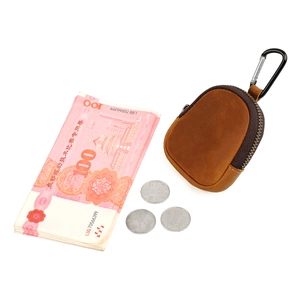 Detailed view of brown crazy horse leather coin purse with zipper and metal carabiner