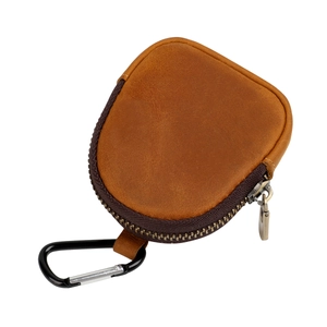 Detail view of vintage brown leather pouch with metal zipper and carabiner clip