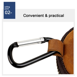 Detail of crazy horse leather coin purse with metal carabiner and secure zipper closure