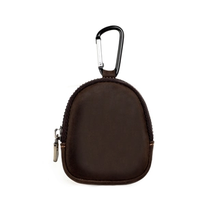 Macro view of dark brown crazy horse leather pouch with vintage metal zipper and carabiner