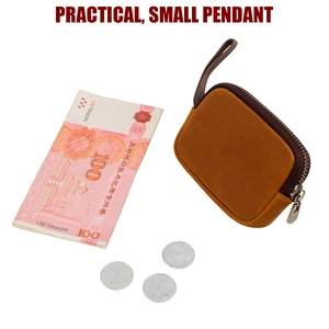 Detail view of brown crazy horse leather coin pouch with coins and cash for scale