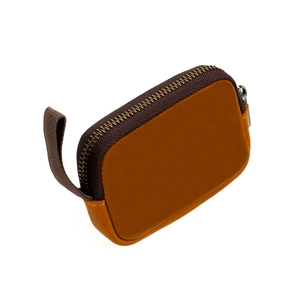 Detailed view of two-tone leather coin pouch with zipper closure and wrist strap