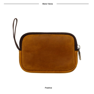 Front view of a retro caramel leather coin pouch with a bronze zipper and wrist strap