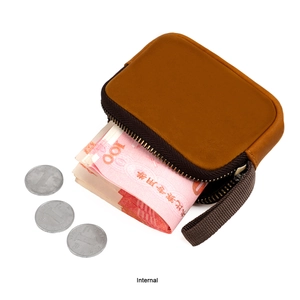 Detailed interior of vintage brown leather coin pouch showing money compartment and zipper