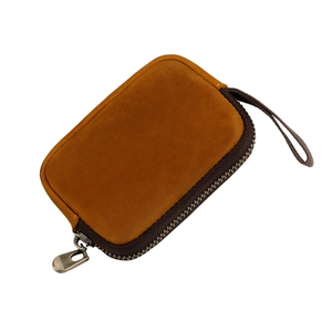 Vintage crazy horse leather mini pouch with bronze zipper and hand strap in ginger yellow