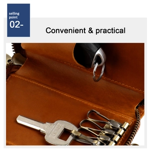 Close-up of crazy horse leather key pouch interior with bronze metal hooks and zipper