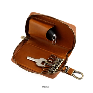 Detail view of brown crazy horse leather key pouch interior with six antique metal hooks