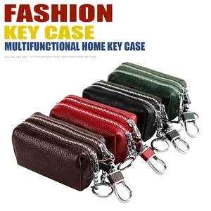 Detail view of genuine leather car key cases with double zippers in four assorted colors