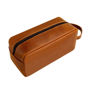 Vintage bruine gekke paardenleren toilettas met handvat en crème stikseldetails