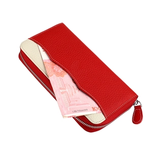 Close-up of red pebbled leather wallet with contrast stitching and RFID card slots