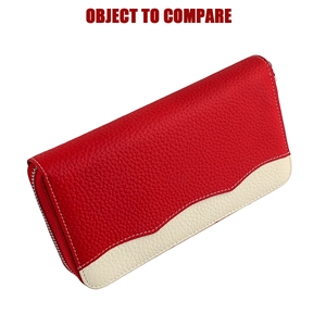 Detail showing red and white contrast litchi grain leather and precise white stitching