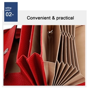 Detail of red pebbled leather wallet featuring multiple accordion-style internal card slots
