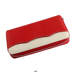 Close-up of red and white pebbled leather wallet featuring secure metal zipper closure