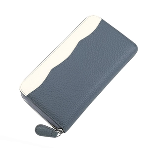 Detail of genuine pebbled leather wallet featuring gray-blue and beige contrast stitching