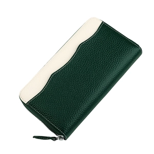 Detail of green and cream pebbled leather wallet with metallic zipper and stitching