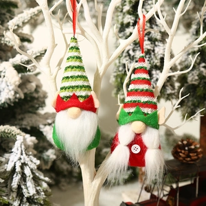 Christmas gnome doll hanging decorations with sequined hats and knit bodies on tree