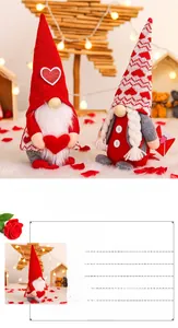 Close-up of handmade Valentine gnome plushies with heart details and holiday ornaments