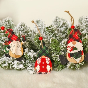 Three-piece set of painted wooden Christmas gnome ornaments with buffalo plaid hats