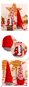 Detail of handmade Valentine Gnomes with knitted red hats and heart envelope props