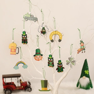 St. Patrick's Day wooden ornaments featuring shamrocks and gnomes on a white tree
