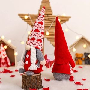 Romantic Valentine Gnomes plush set with heart patterns and knitted hats on white fur base
